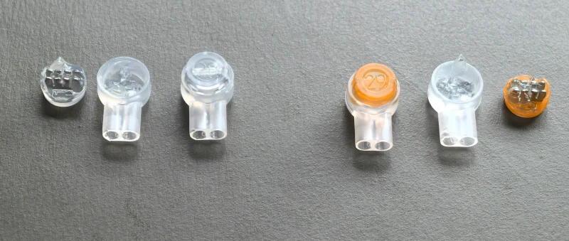 UY2 connector yellow and clear cap comparison showing internal gel and IDC blade