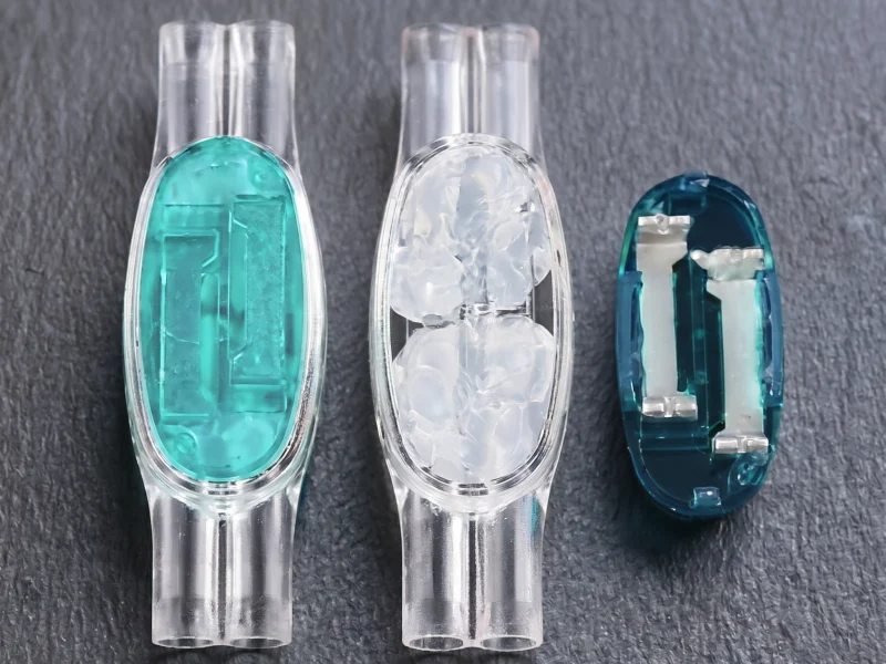 U1B connector open cap showing two-hole internal contact elements and gel
