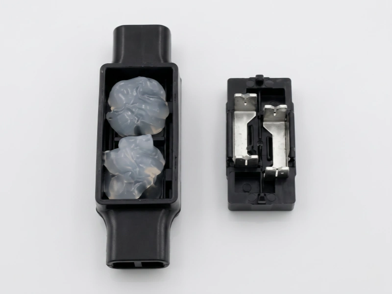 UDW2 connector open cap showing internal contact elements and gel